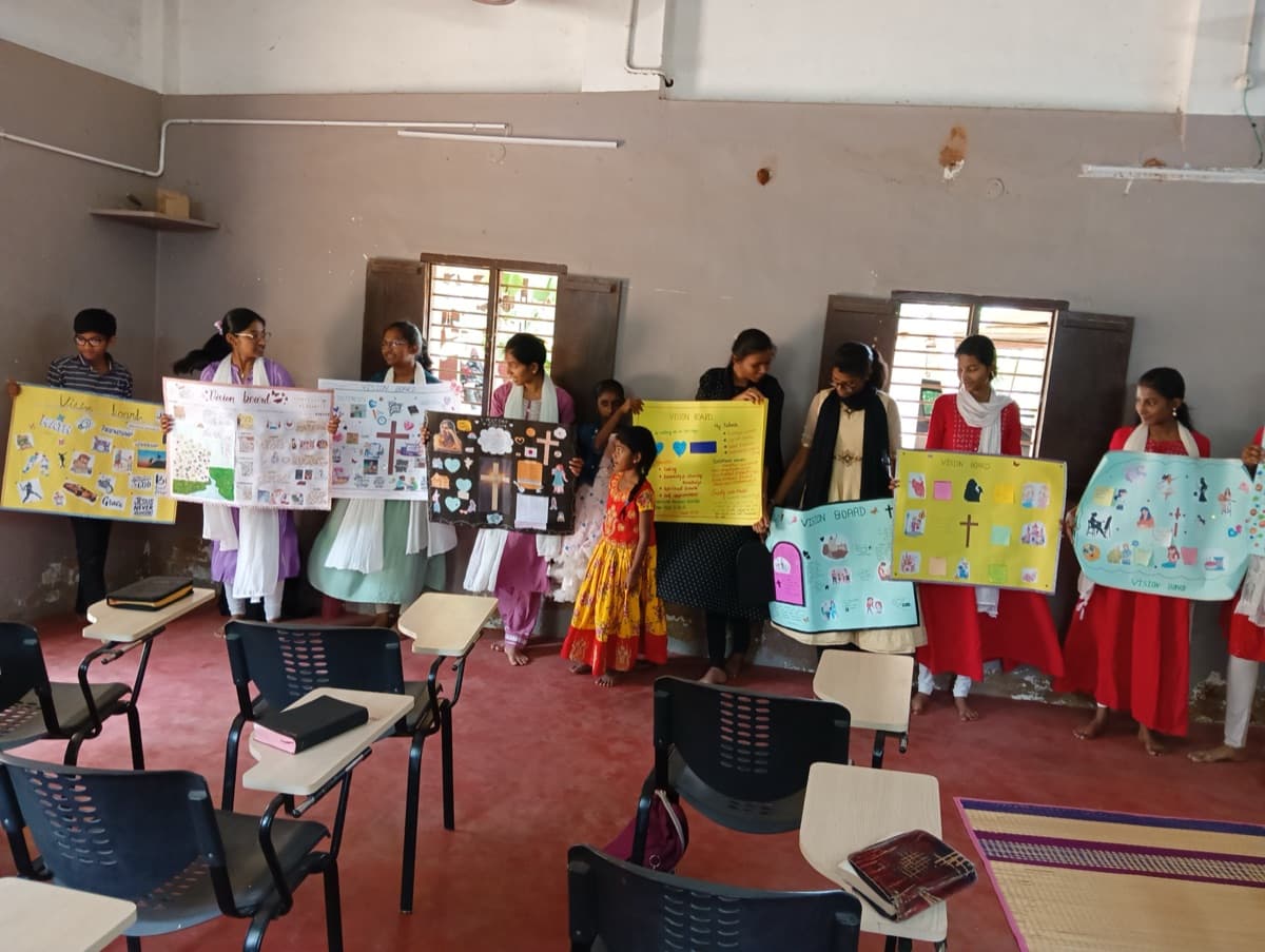 Youth presenting vision boards during a leadership training session